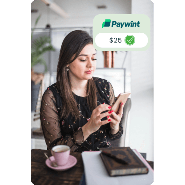 Fast & Convenient Bill Payment Processing Woman Using Her Smartphone in a Café, with a Paywint Payment Confirmation Pop-Up, Showcasing Instant Transactions