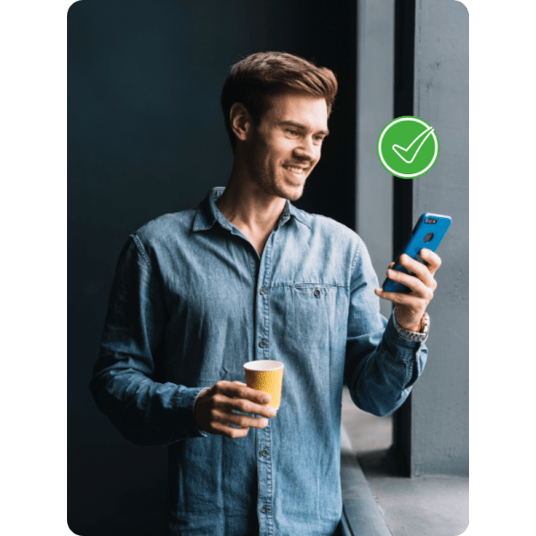 How Paywint Simplifies Cash Transfers A Man Enjoys Coffee While Checking His Phone, Illustrating How Paywint Simplifies Cash Transfers