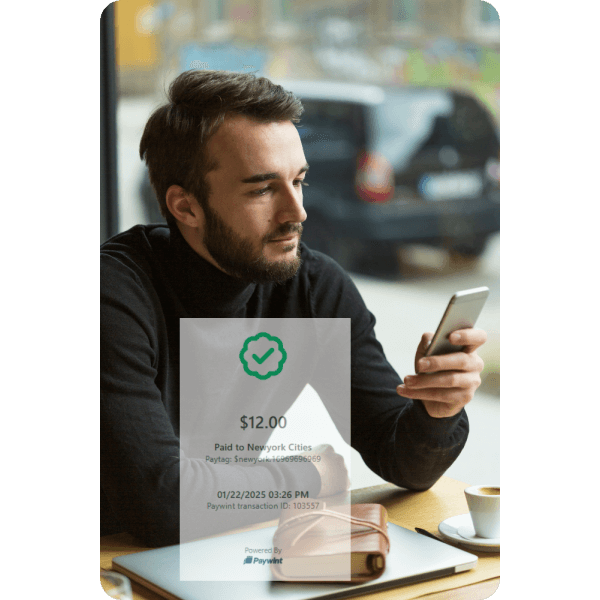 Instant Transfers Anytime A Man Sitting at a Café Using His Smartphone with a Paywint Transaction Confirmation Overlay Showing Payment Details