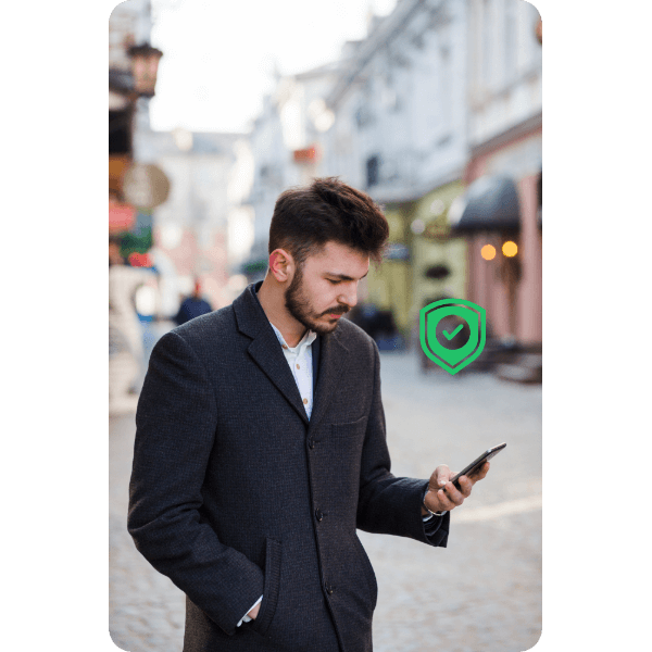 Secure & Reliable Bill Payment Man in a Formal Outfit Using His Smartphone Outdoors with a Security Shield Icon, Symbolizing Paywint’s Secure Payment Processing