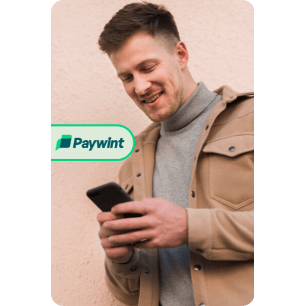 Why Choose Paywint? Smiling Man Using His Smartphone with the Paywint Logo, Representing a Seamless and User-Friendly Payment Experience