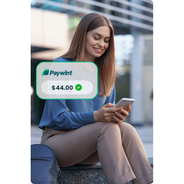 A Trusted Choice for Digital Transactions Smiling Man Using His Smartphone with the Paywint Logo, Representing a Seamless and User-Friendly Payment Experience