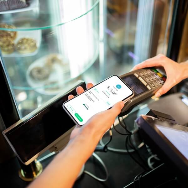 Real Time Payments A Contactless Payment Being Made at a Store Using a Smartphone and a POS Terminal, with a Digital Receipt Displayed