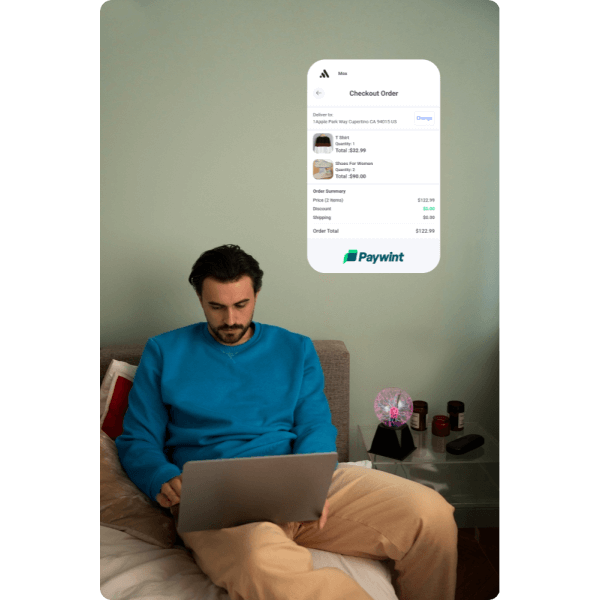 Reduce Cart Abandonment & Increase Sales A Man in a Blue Sweater Using a Laptop While a Paywint Checkout Screen Is Displayed Above Him