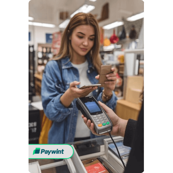 Scalable and Reliable Payment Solutions A Smiling Cashier Using a POS System with Paywint for Seamless Payment Processing