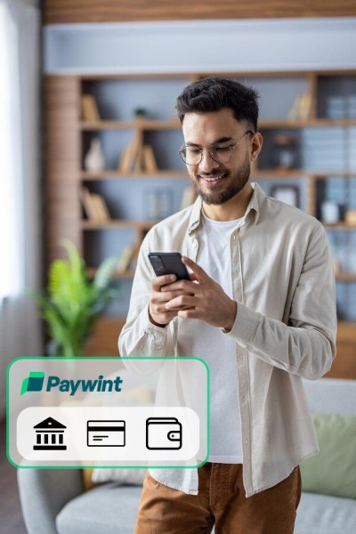 Multiple Payment Methods for Convenience Smiling Man Using a Smartphone, with Paywint Icons for Bank, Card, and Wallet Payments