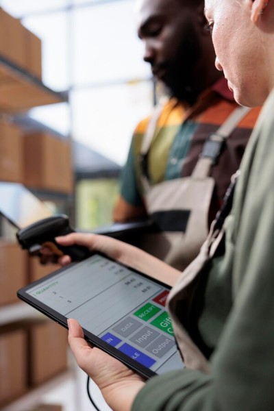 Track, Manage, and Grow with Confidence Digital Financial Reports Displayed on a Laptop Screen in an Office