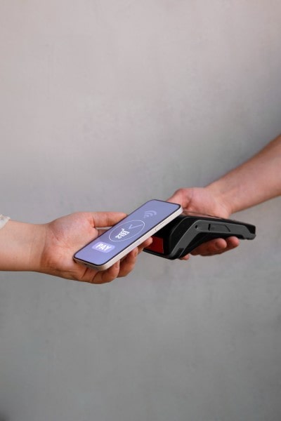 How Pay By Phone Works with Paywint Mobile Expense Tracking Categories on a Smartphone Surrounded by Receipts