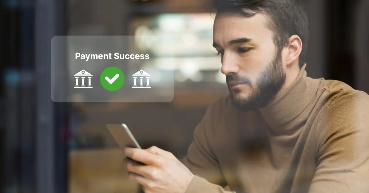 Paywint Introduces Instant ACH Payments to Transform Digital Transactions A Person in a Brown Sweater Checks Their Phone While a Notification Shows "Payment Success" with a Green Checkmark