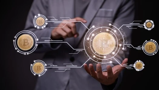 A Business Professional Gestures Towards a Digital Display of Bitcoin Symbols and Connections, Symbolizing Cryptocurrency and Technology