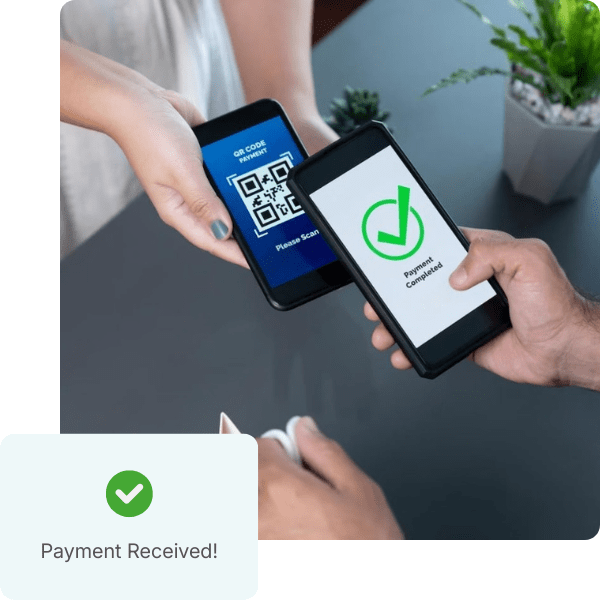 Two Hands Holding Smartphones for a Payment Transaction, One Displaying a QR Code, and the Other Showing "Payment Completed!" with a Checkmark