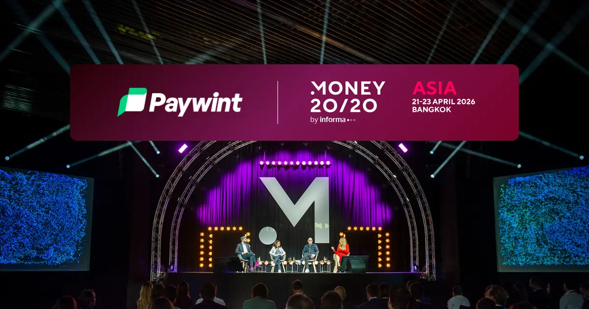 Paywint is an Official Sponsor Partner at Money 20/20 Asia 2026 A Conference Stage Featuring Speakers, with Colorful Lighting and a Banner for Paywint and Money 20/20 Asia, Scheduled for April 2026 in Bangkok