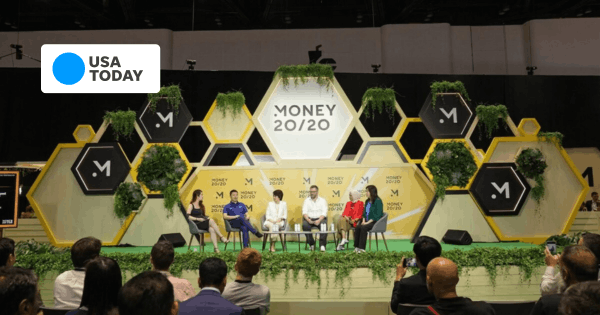 Panel Discussion at Money 20/20 Event with Five Speakers on Stage and Audience Seated in Front