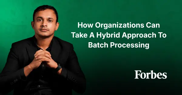 A Man in a Black Suit Poses Against a Green Background with the Text How Organizations Can Take a Hybrid Approach to Batch Processing and Forbes Logo